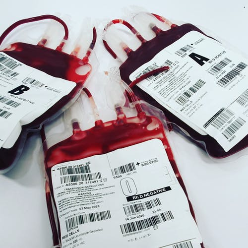 3 bags of blood on a white desk