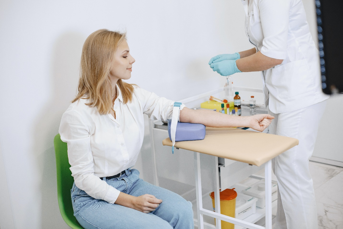 a doctor drawing blood from a patient