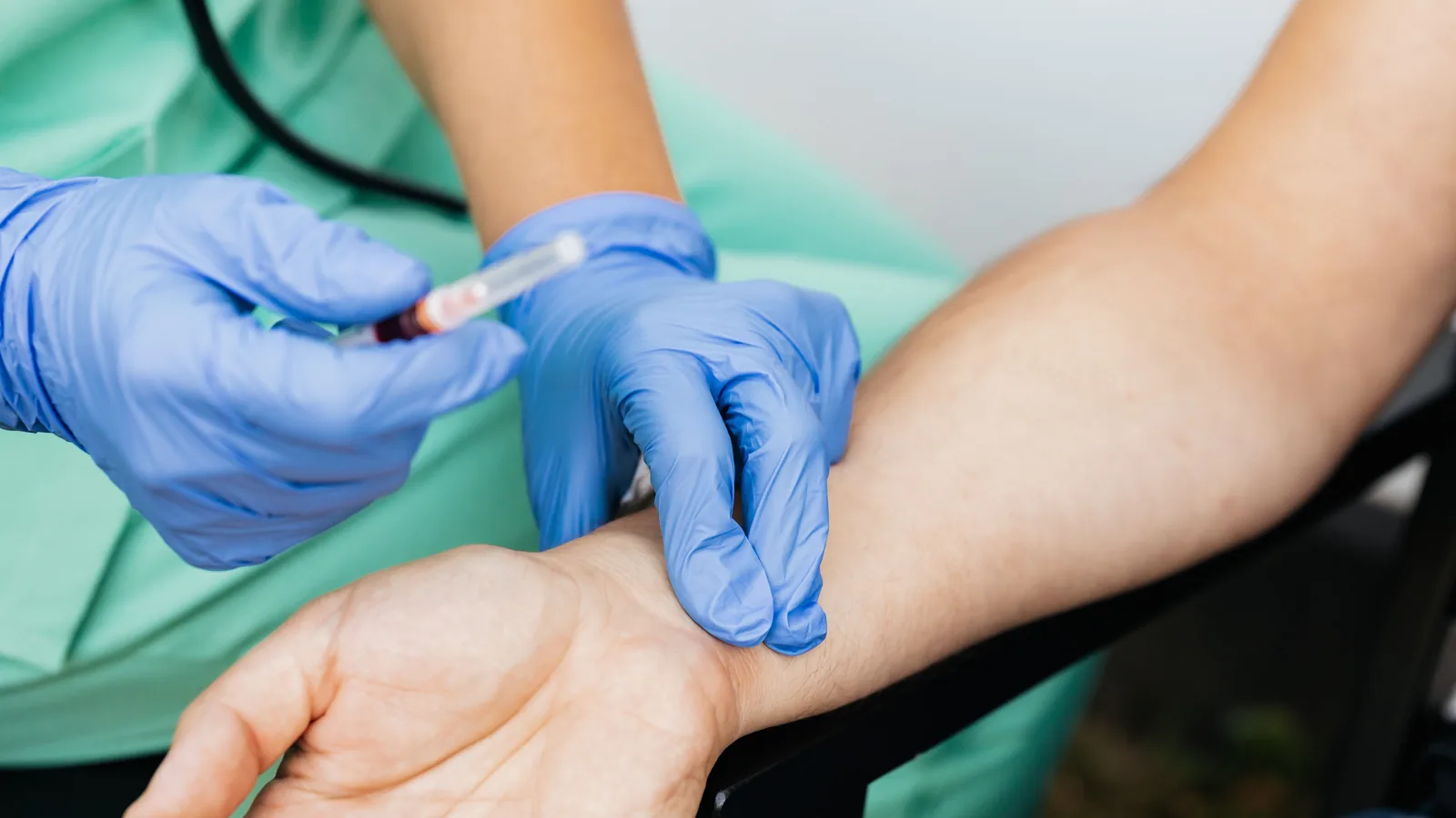 therapeutic phlebotomy Virginia, certified phlebotomist performing an at home treatment